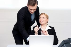 Business People At Work. Male Pointing At Laptop
